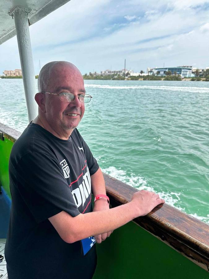 A man enjoying a boat ride on the water